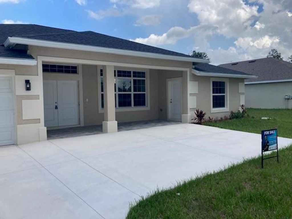 Photo of 1661 SW California Boulevard, Port Saint Lucie, FL 34953 (MLS # F10515525)