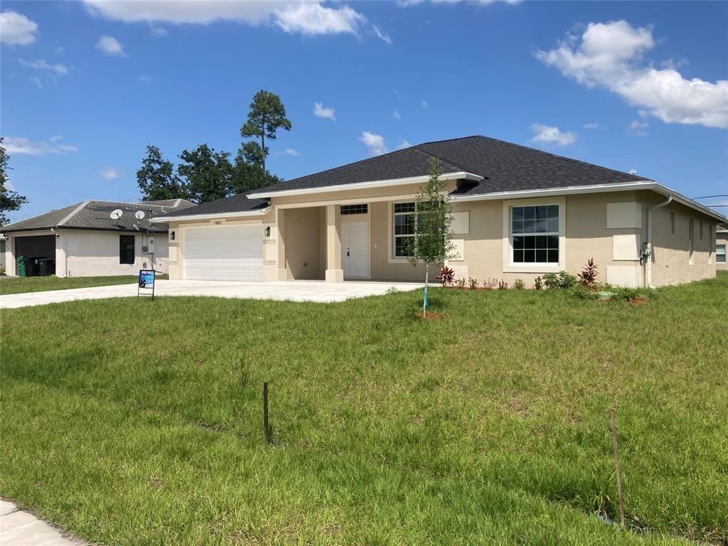 Photo of 1661 SW California Boulevard, Port Saint Lucie, FL 34953 (MLS # F10515525)