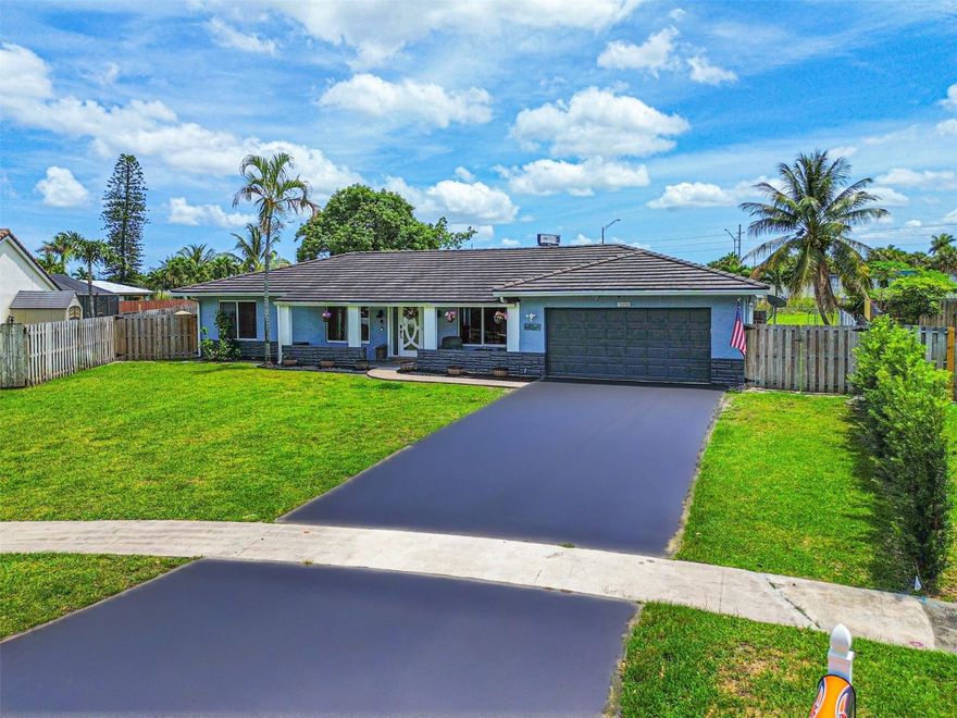 Welcome to this beautifully updated 4 bed, 2.5 bath single family residence in Plantation. Featuring a 5 year old roof, hurricane protection, and a tankless water heater, peace of mind comes built in. Step inside to find modern finishes throughout, including newly renovated bathrooms and a sleek kitchen with Samsung appliances. Outside, your private backyard oasis awaits—enjoy a resurfaced pool, mature fruit trees, and a spacious covered patio with elegant travertine pavers. The fully fenced yard easily accommodates your RV, boat, or both. This home checks every box with nothing left undone—style, comfort, and functionality all in a prime Plantation location close to parks, top rated schools, dining, & major highways. Don’t miss your opportunity to own this turnkey gem!