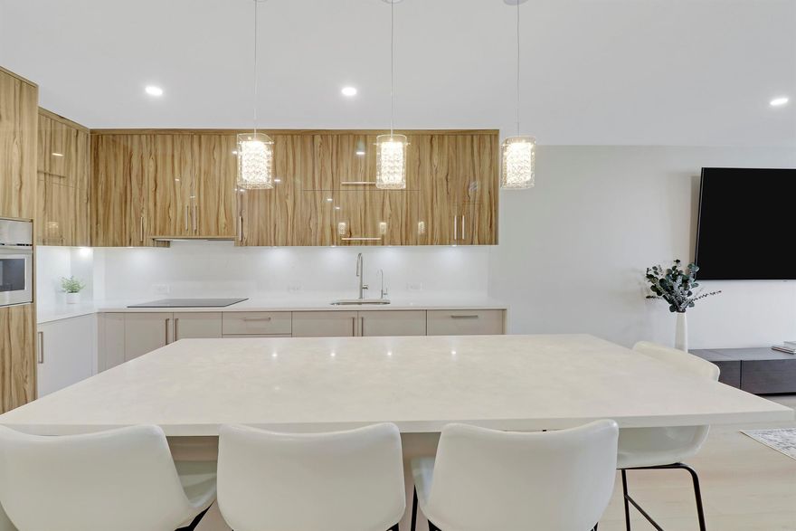 Welcome to this impeccably renovated and fully furnished 1BR/1.5BA condo in highly desired Le Chateau. This stunning residence features an open, high-end kitchen, premium finishes, designer furnishings, housewares, and impact windows. Simply unpack and enjoy! Relax on your private patio offering peaceful northern ocean views. The community is directly on the gorgeous beach and offers a beachfront pool, fitness center, game room, and more. Covered reserved parking included. Spend your winter in luxury--available mid/late December through March 2026. Minimum 90-day rental.