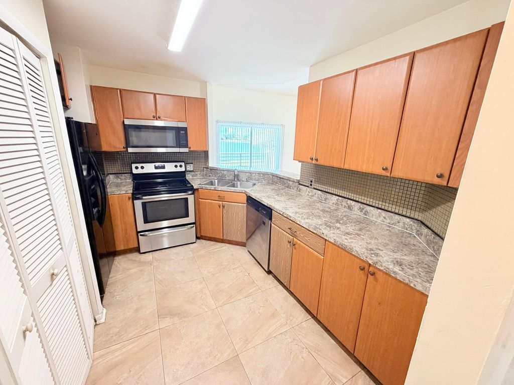 Photo of 3453 NW 44th Street #201, Oakland Park, FL 33309 (MLS # B26019424)