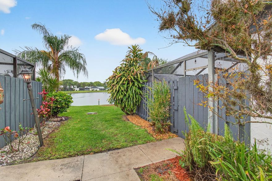 Enjoy lakefront living in this beautiful townhome located in Summit Pines, a gated community in West Palm Beach with a low HOA. This 3-bedroom townhome sits directly on a large lake with a beautiful fountain, offering peaceful water views right from your home.  Just steps from the community pool, the property also features a spacious private courtyard—perfect for relaxing or entertaining. Inside, enjoy a kitchen with granite countertops, stainless steel appliances and beautiful wood finishes.  With plenty of guest parking and a prime location near Palm Beach International Airport, downtown, shopping, and dining, this home offers the perfect blend of comfort and convenience.