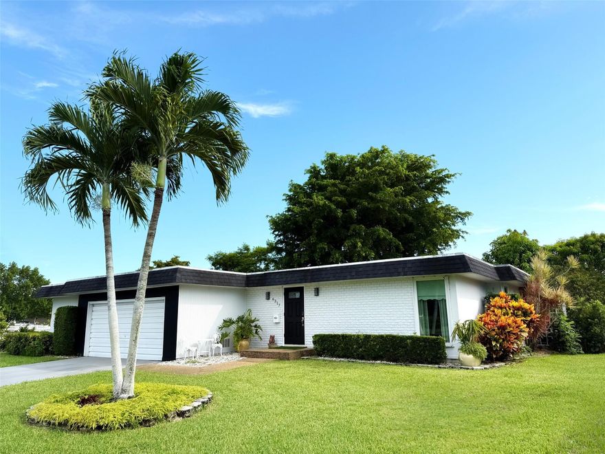 *Waterview* Welcome to this beautifully updated 2-bedroom, 2-bath home featuring a versatile BONUS room (perfect as an office, storage, or additional bedroom) and an eclosed Florida room with AC/Heater with kitchen/dining room access. Master room has outdoor access. This home offers tranquil water views from both the back and side, creating a private and peaceful retreat. Community pool located at clubhouse is just steps away (across the street) creating easy access without the upkeep. Upgrades include: NEW kitchen + appliances, ceramic tile flooring, covered tiled deck, lush tropical landscaping with fruit trees (Mango, Avocado, Seville Orange, Creole Lime, Guava, +), Impact Windows (2024 -Partial), Larger AC unit (2021), Roof (2020), fresh paint outdoors & indoors  + more!