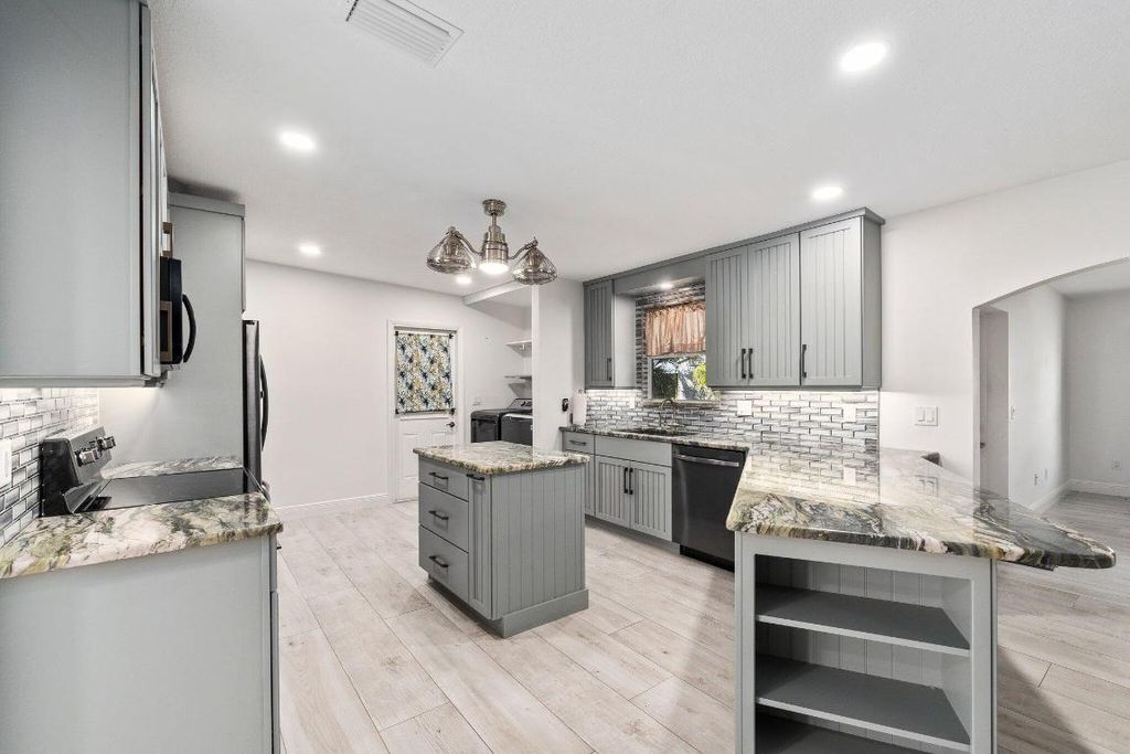 Photo of 113 SE Calmoso Drive, Port Saint Lucie, FL 34983 (MLS # R10937281)