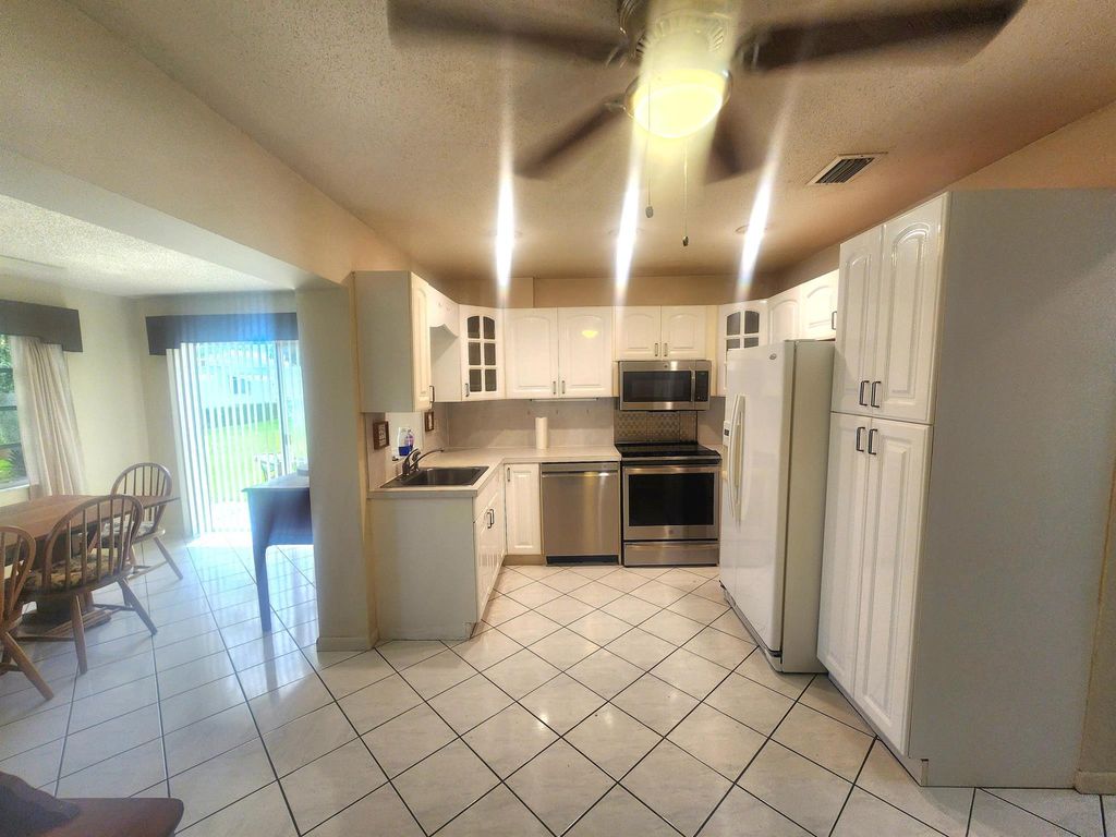 Photo of 108 SW 18th Street, Boynton Beach, FL 33426 (MLS # R11124190)