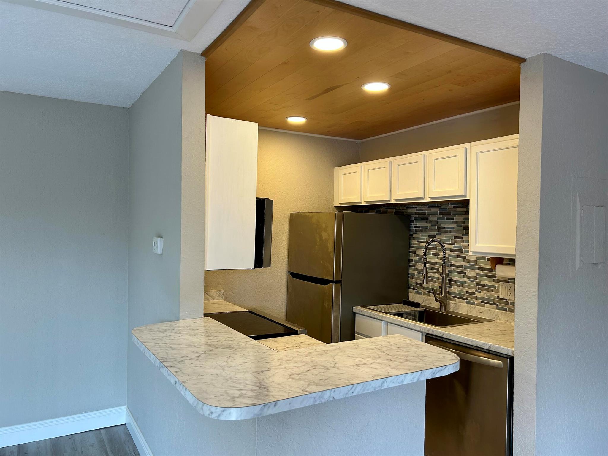 Updated kitchen and half bathroom, new luxury vinyl flooging through out,, barn doors on closets. Open floorplan with kitchen looing onto living room and dining room. Washer and dryer in unit. Balcony and large patio under the balcony for plently of outdoor space all fenced. Freshly painted inside and balcony/stairs. Excellent location, close to I-95, parks and the beach. Community has a large pool, clubhouse, tennis and playground.