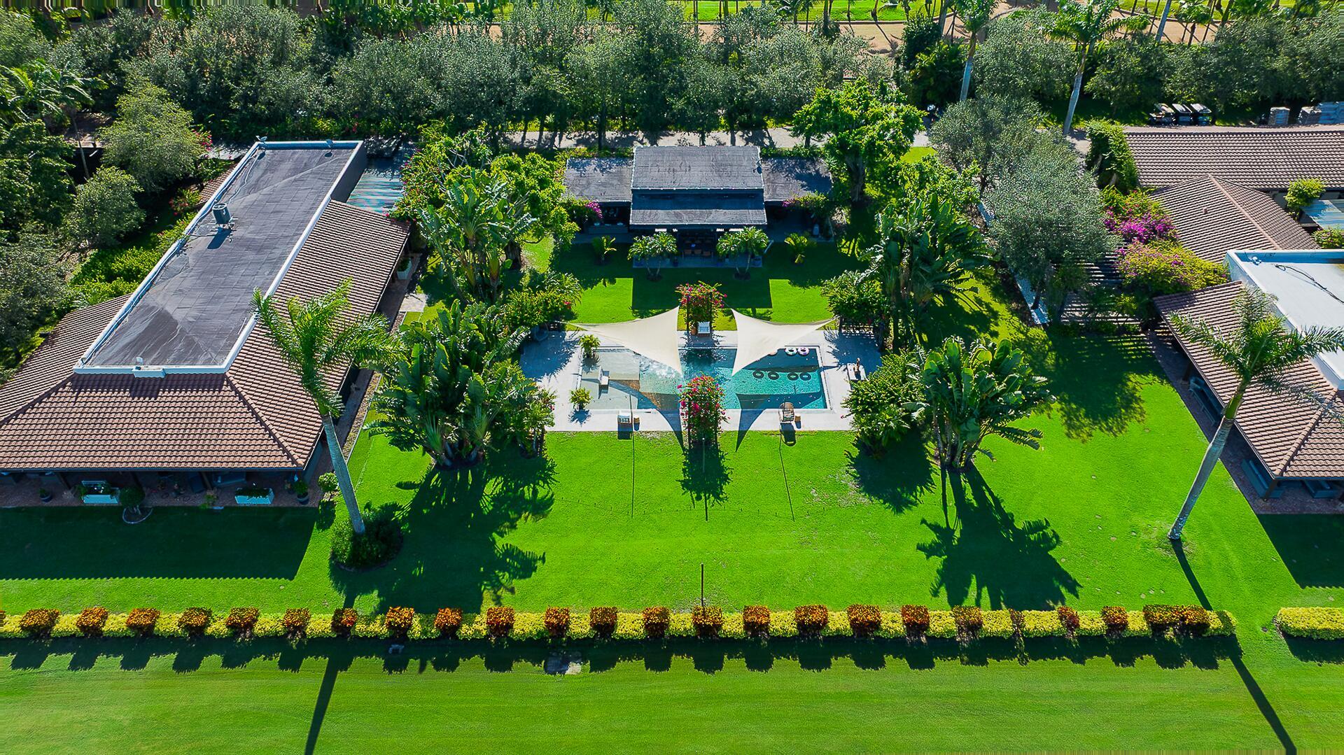 Welcome to Eye Candy Jumpers, a premier equestrian estate where world-class sport and refined luxury unite. Situated in the heart of Wellington, this distinguished haven is home to one of the most recognized names in international Show Jumping, celebrated for producing top competitors and excelling on the global stage.Designed with the serious rider in mind, the estate features a gorgeous irrigated arena with premium GGT footing and 7 acre derby field, ensuring peak performance conditions. The stables currently feature 10 impeccably maintained stalls, while expansive grass fields and expertly designed paddocks create an ideal environment for both training and relaxation.
