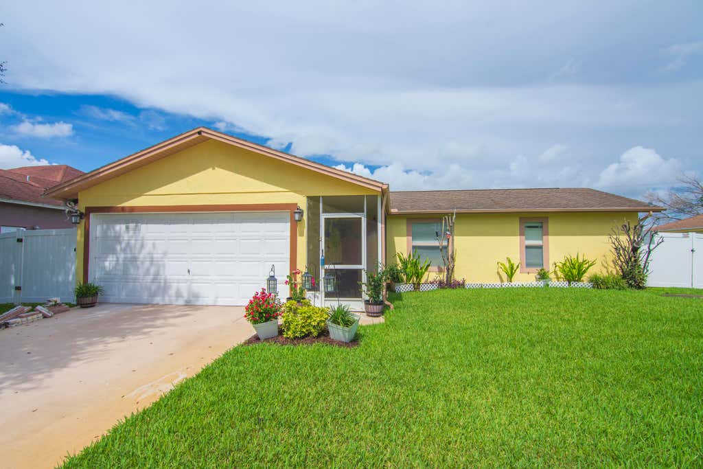 Photo of 1842 SE CARVALHO Street, Port Saint Lucie, FL 34983 (MLS # B26062374)