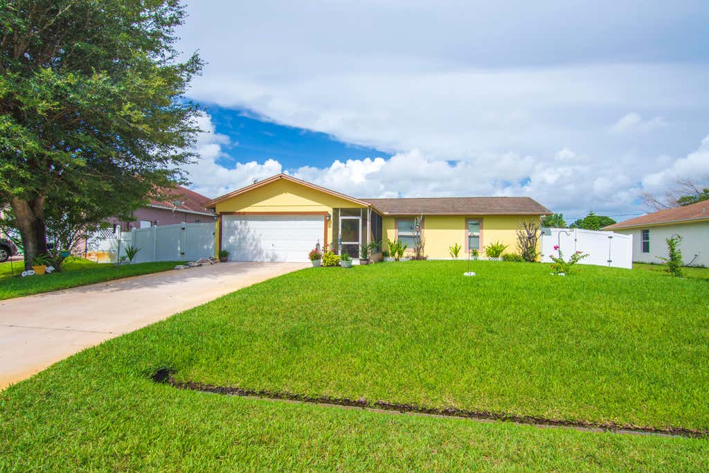 Photo of 1842 SE CARVALHO Street, Port Saint Lucie, FL 34983 (MLS # B26062374)