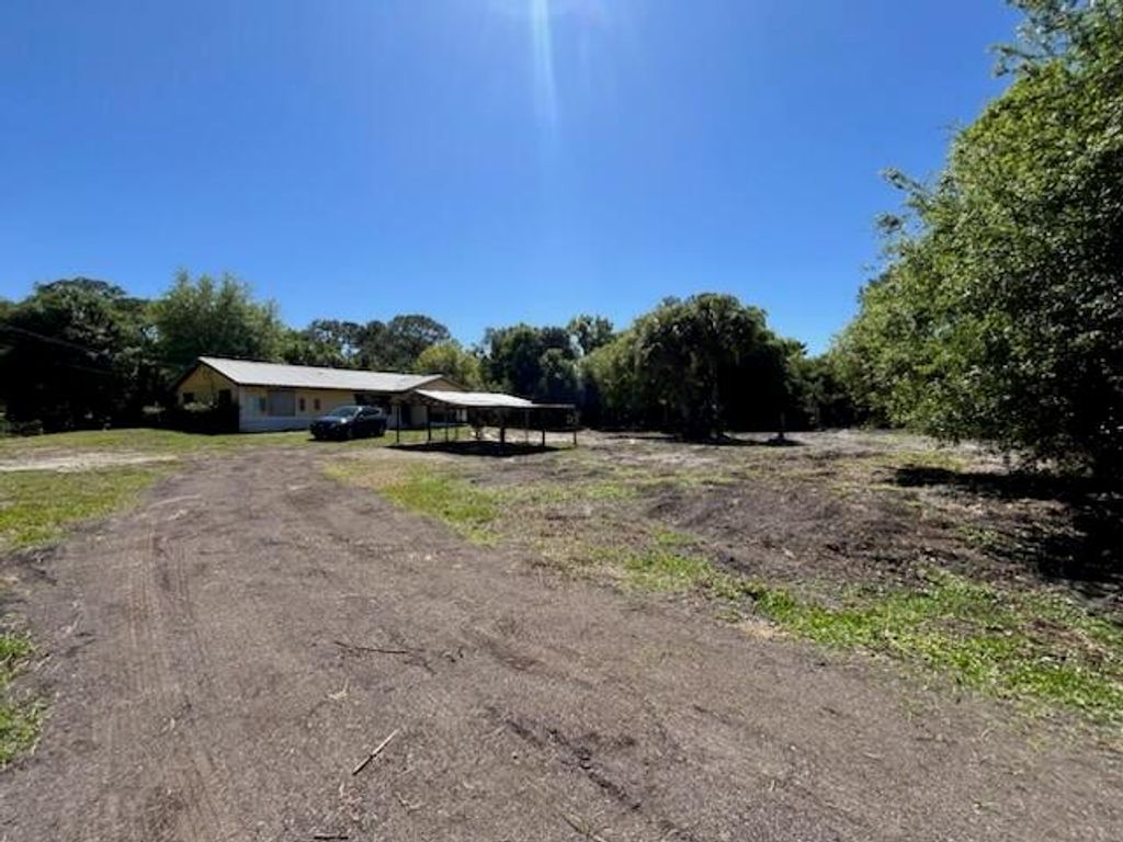 Photo of 9005 SW Kansas Avenue, Stuart, FL 34997 (MLS # R11070544)