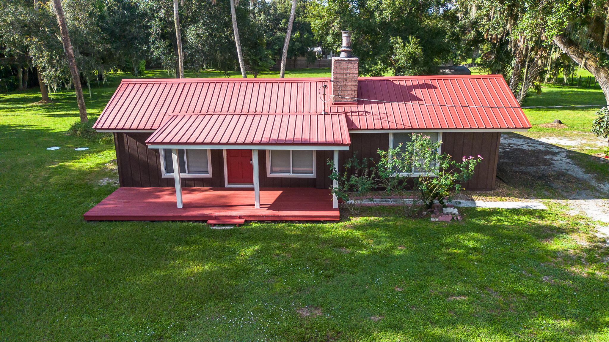 Fully remodeled 2-bedroom, 2-bathroom home sits on 1.34-acres in the SW section. City water service, commercial grade metal roof, new AC, new doors windows and hardware, new septic system and drain field., The property is move-in ready. Inside, enjoy an open floor plan with updated finishes, a stylish kitchen with stainless steel appliances, and spa-like bathrooms. Outside, the expansive yard provides endless possibilities, from gardening to creating your dream outdoor oasis. 50 amp RV hookup, 2 storage sheds, mature oaks and room to build a pool. Bring the ponies, your RV or boat, plenty of room for toys and activities.