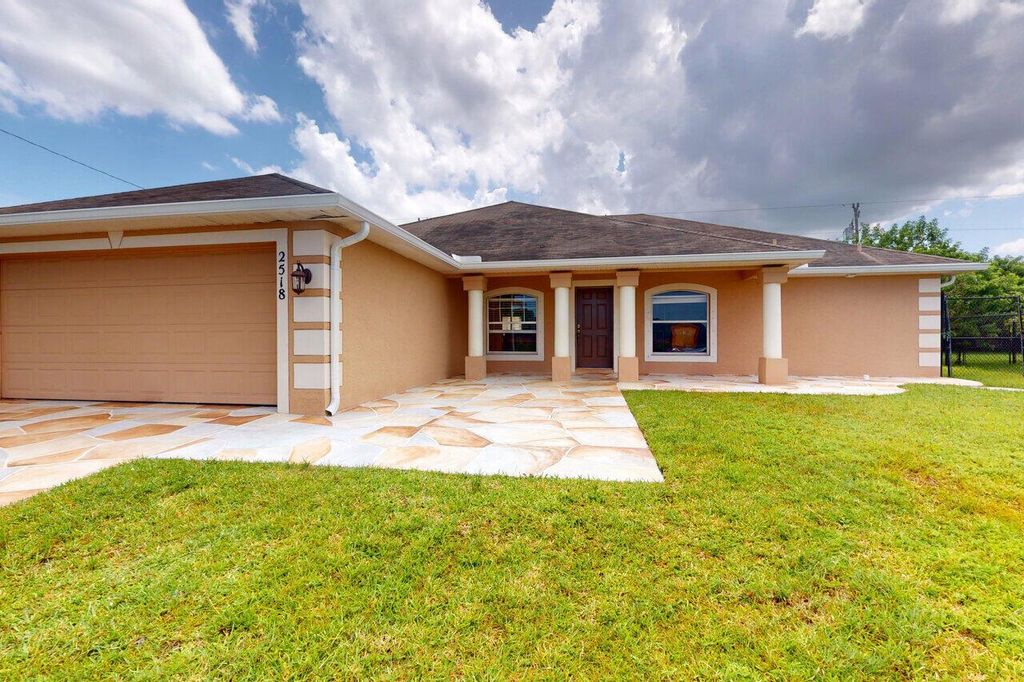Photo of 2518 SW Fair Isle Road, Port St Lucie, FL 34987 (MLS # R10912774)