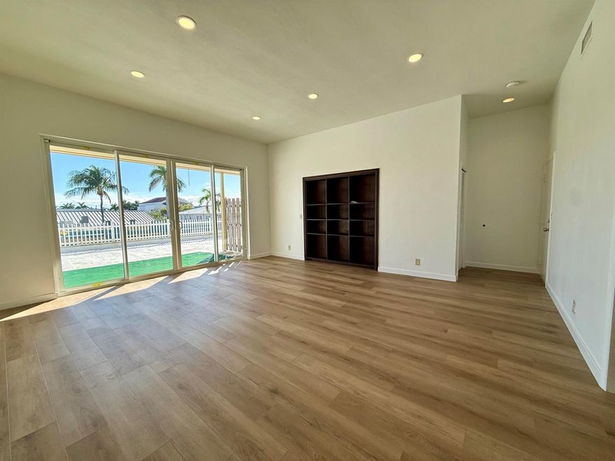 This unique 2BR 2BA, 1,250 sq. ft. apartment sits directly on Atlantic Avenue and only 100 yards from the sand, offering the ultimate walkable beach lifestyle. Updated with impact windows, high ceilings, and a stylish built-in library shelf, the home feels bright and open. Step onto your private balcony for a glimpse of the ocean and to enjoy daily sunrises and nightly sunsets. With cafes, restaurants, boutiques, and the beach just steps away, the location cannot be matched. Pet friendly. Upstairs location with no elevator. 1 Assigned parking spot.