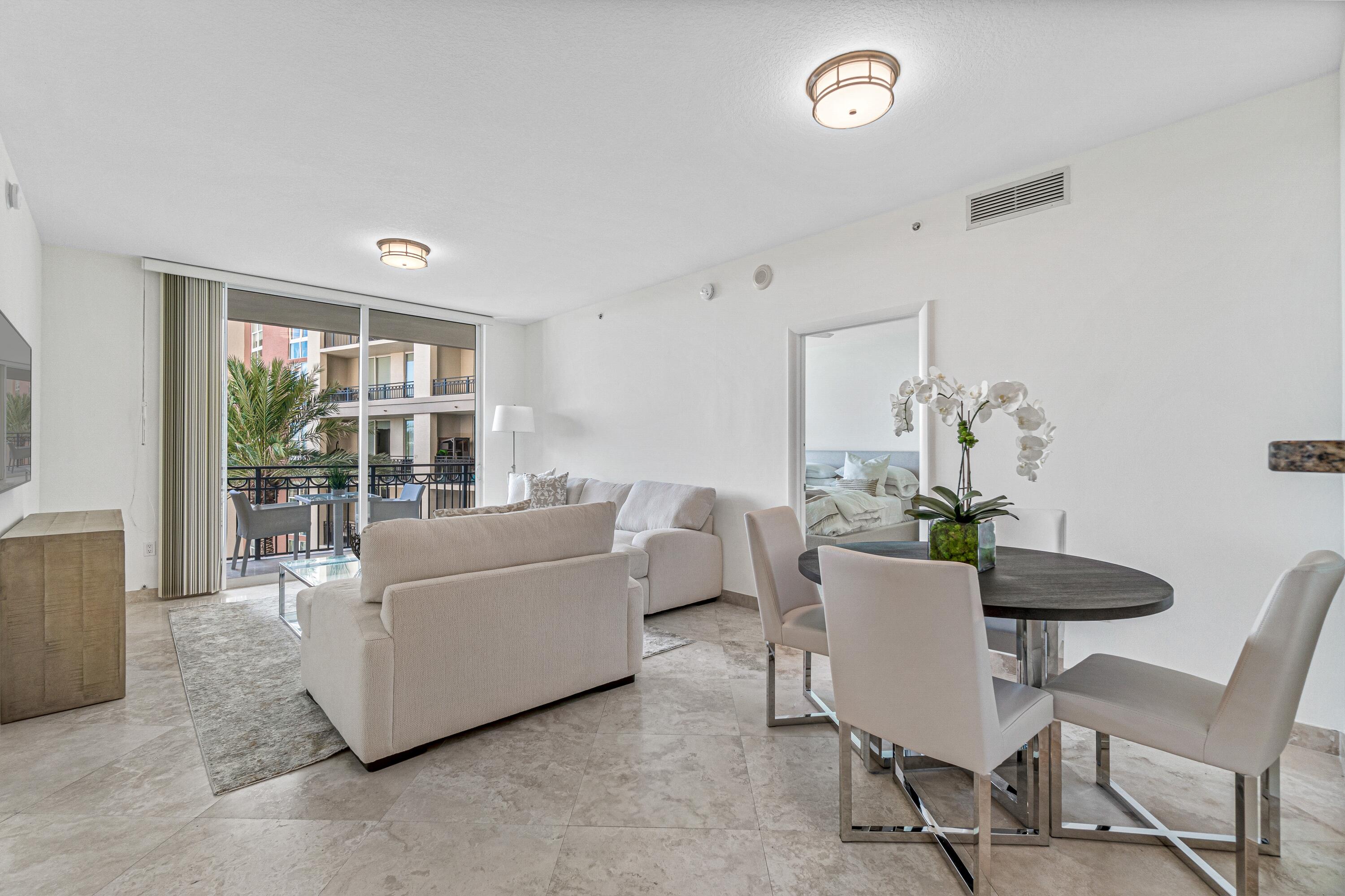 Fabulous 2-bedroom, 2-bathroom fully furnished turn-key residence that lives large. Featuring an extra-large continuous marble balcony, accessible from the primary bedroom and living room. It overlooks the resort like pool, spa and summer kitchen areas which highlight views of the intracoastal waterway, ocean, and city skyline sunsets. Just honed marble flooring throughout the main living areas. Brand new light carpeting in both bedrooms, new full-size washer & dryer. All furnishings are brand new, and kitchen completely fitted. One parking space. Amenities include an expansive resort experience, infinity edge pool, summer kitchen, bar and grilling area with TV. Ample lounge areas and seating, hot tub, shaded pergola, and beautiful landscaping throughout. Wi-Fi in all amenity areas...