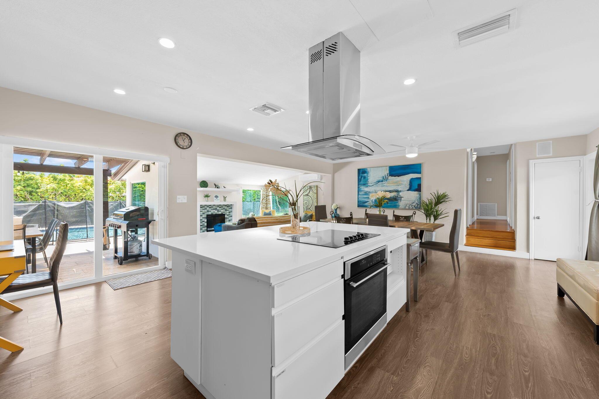 Welcome to The Cove, where luxury and convenience meet! This beautifully renovated 3 bed, 2 bath home is turnkey & move-in ready.Amazing neighborhood, located within walking distance to the beach, Deerfield Pier, restaurants, and shops! This home features an incredible fully fenced in backyard with a private heated pool, putting green, separate jacuzzi, grill and outdoor dinning area! The kitchen boasts quartz countertops and stainless steelappliances. The open concept floor plan offers endless opportunities to entertain. Impact windows/doors throughout. Interior laundry room & storage space. Don't miss the opportunity to live in a fully furnished home in the most desirable location!