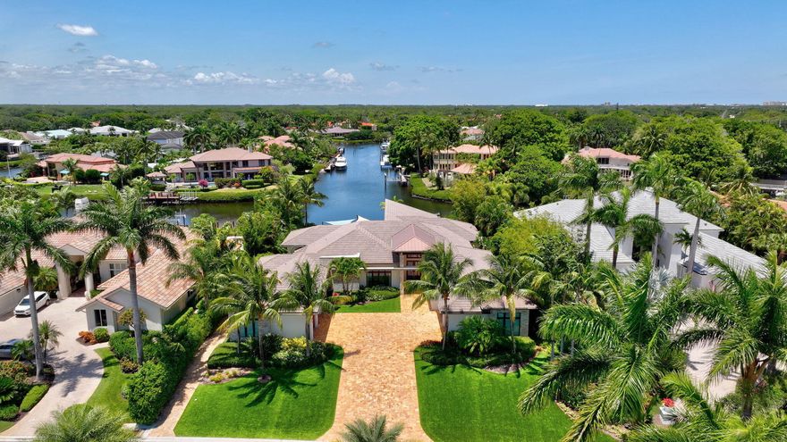 Welcome to waterfront living, in prestigious Frenchman's Creek. This exquisite 4-bedroom, 4.5-bath residence offers breathtaking water views, a private dock with boat lift, and direct access to the Intracoastal. Designed for both relaxation and entertainment, the outdoor oasis features a summer kitchen and a resort-style pool with spa, perfect for unwinding or hosting guests. Inside, the spacious chef's kitchen--complete with a butler's pantry and breakfast nook--offers a seamless blend of elegance and functionality. The grand living room, adorned with a decorative fireplace, wet bar, and floor-to-ceiling glass, invites natural light and showcases stunning vistas. 4-car + golf cart garage and unparalleled amenities, this home is a must-see for those seeking sophistication and comfort