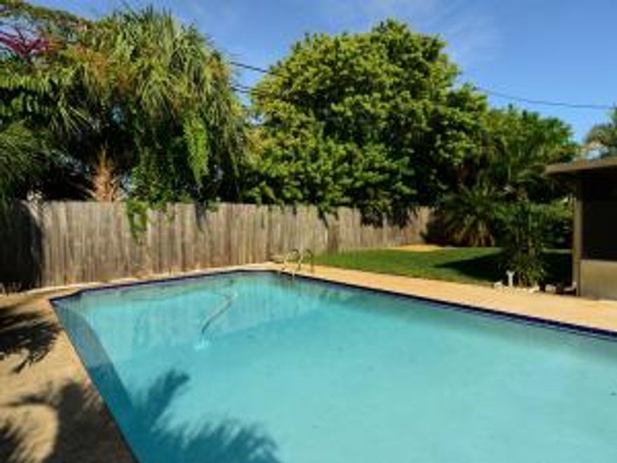 Great opportunity located in the heart of Palm Beach Gardens. This charming partially updated home offers engineered wood floors in main living area. Kitchen with newer appliances. Enclosed Landry room off of patio. Nice covered/screened patio, with free standing brick charcoal grill overlooking a large pool and spacious backyard. This one will not last!All sizes and measurements deemed reliable but not guaranteed.