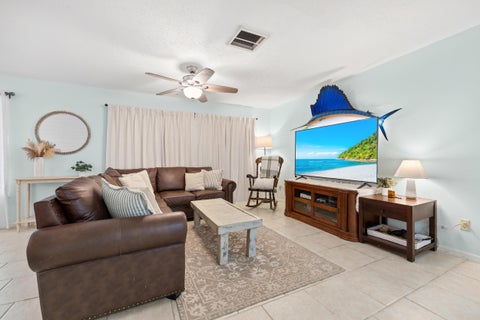 Photo of 3474 NE Sandra Drive, Jensen Beach, FL 34957 (MLS # B26078220)