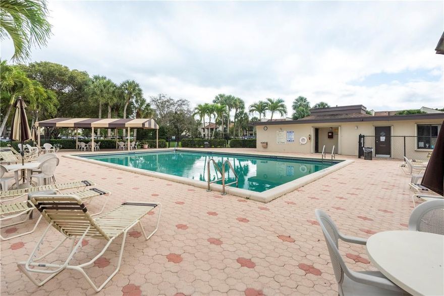 Beautiful 2nd Floor Gardens IV unit with Screen Balcony overlooking the Lake and Garden Views. Well maintained with Lovely Wood Flooring, Hunter-Douglas Window Sheers, Tankless Hot Water Heater, Wine Refrigerator in Kitchen, Hurricane Accordion Shutters, Guest Room has a Built in Murphy Bed and Desk. Extra Storage outside your front door, One Assigned Parking Space, Eat-In Kitchen, Laundry located inside Kitchen, Corner Unit very Private & Quiet only 4 unit per Building. Short walk to the Community Pool acrossfrom this Building, Living in The Gardens gives you access to the Private Country Club with Restaurant, Sports Bar, Tennis, Gym, Pool, Golf, Tot Lot. Community within A Rated School District. Water, Trash, Basic Cable included. Some furniture stays with property.