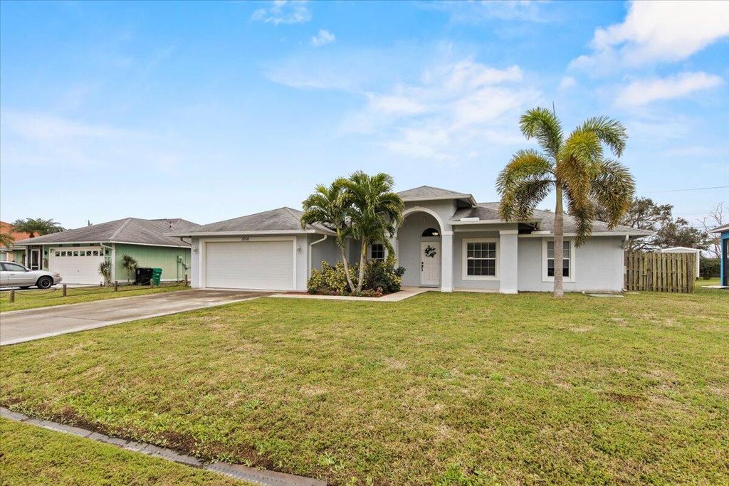Photo of 1058 SW Aswan Avenue, Port Saint Lucie, FL 34953 (MLS # R10958783)