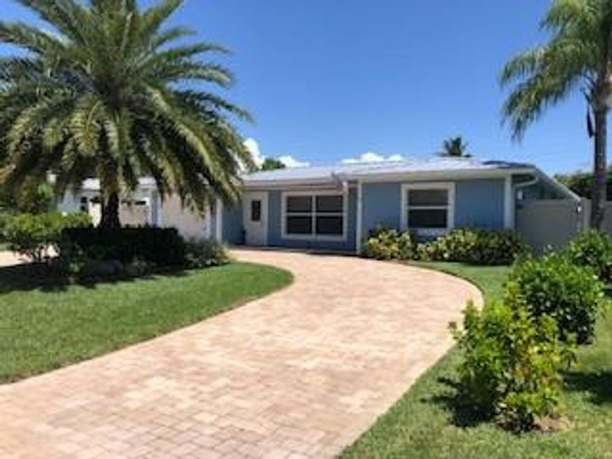 LOCATION. LIFESTYLE. EAST POMPANO BEACH IS HAPPENING! FLORIDA KEYS THEME! This home was remodeled in 2018 with permits. New standing seam metal roof, underground plumbing, impact windows, paint, and many modern interior finishes and features. There is a separate hot tub for your enjoyment. The pool has a beach swim out - great for keeping cool. There is a 20KW generator with an automatic switch on. Natural gas cooking. This home is meticulous! Value, Location, Lifestyle