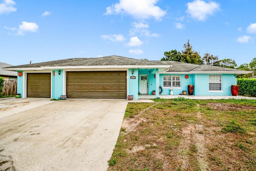 Well-maintained concrete block home featuring 3 bedrooms, 2 bathrooms, and a 3-car garage with a spacious open living area. Tile flooring throughout. The exterior offers pavers surrounding the home and a cozy fire pit, creating an inviting outdoor space. Well cared for and ready for its next owner.