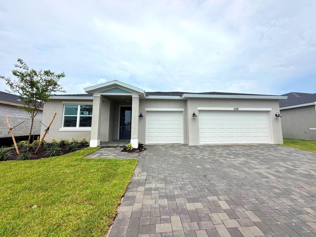 Photo of 5591 Hampton Park Circle, Vero Beach, FL 32966 (MLS # B26074740)