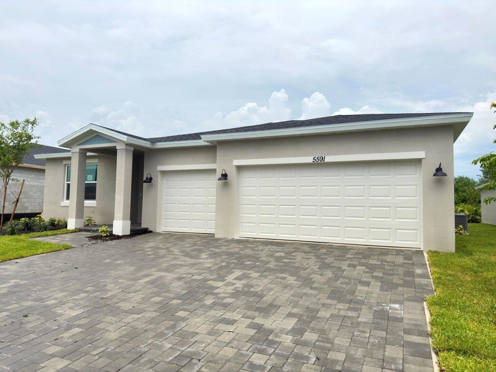 Photo of 5591 Hampton Park Circle, Vero Beach, FL 32966 (MLS # B26074740)