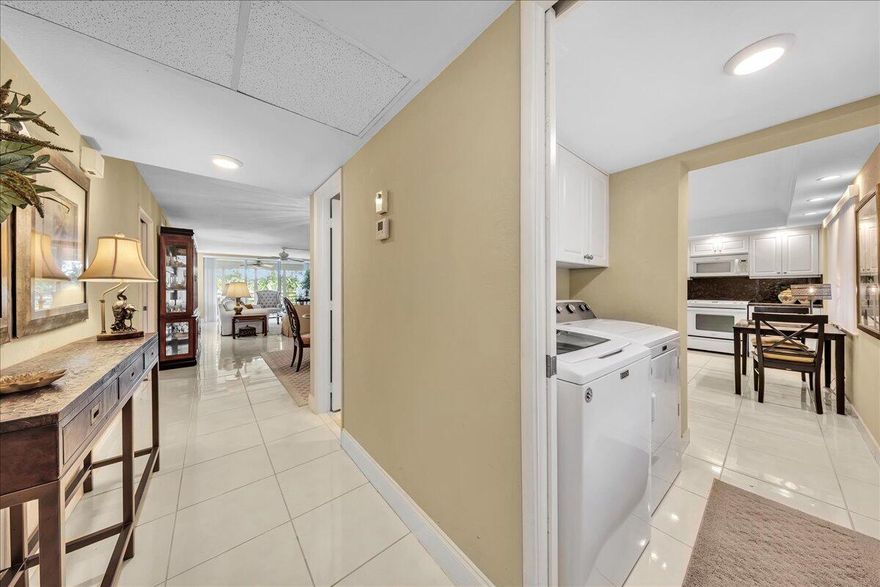 Spacious and updated 3BR/2.5BA "F" model with tile flooring throughout, offered furnished (excluding artwork and items in attachment). The eat-in kitchen features a convenient side-by-side washer and dryer and comfortable space for casual dining. Major updates include A/C (2020), kitchen remodel (2011), and water heater (2004). Building has new roof (2022) & completed the 40-year electrical and building safety inspections. Located in a beautifully maintained community w/ lush landscaping and 2 pets allowed. Association requirements include a minimum 700 credit score, 20% down payment, and ownership for 2 years prior to renting. Seller willing to assist buyer with 10K in closing costs.  There's 2 pool areas w/ grills & a storage unit on the same floor. Pickleball and tennis nearby at park.