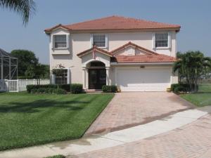 Lovely 4 bedroom 2 bath pool home. Accordion hurricane shutters, upgraded tile flooring on the first floor, newer carpet upstairs. Open light & bright , beautiful free form pool/spa w/screened patio. Quite & private master bedroom on second floor with balcony overlooking beautiful panoramic golf & preserve views. Master also has 9x10 sitting area. Master bath has roman tub w/jets, his & hers closets. Lovely landscaped cul-de-sac lot, gated community with low HOA fees. Close to Wellington schools & walking distance to Wanderers Club. Fabric drapes & rods do not covey.