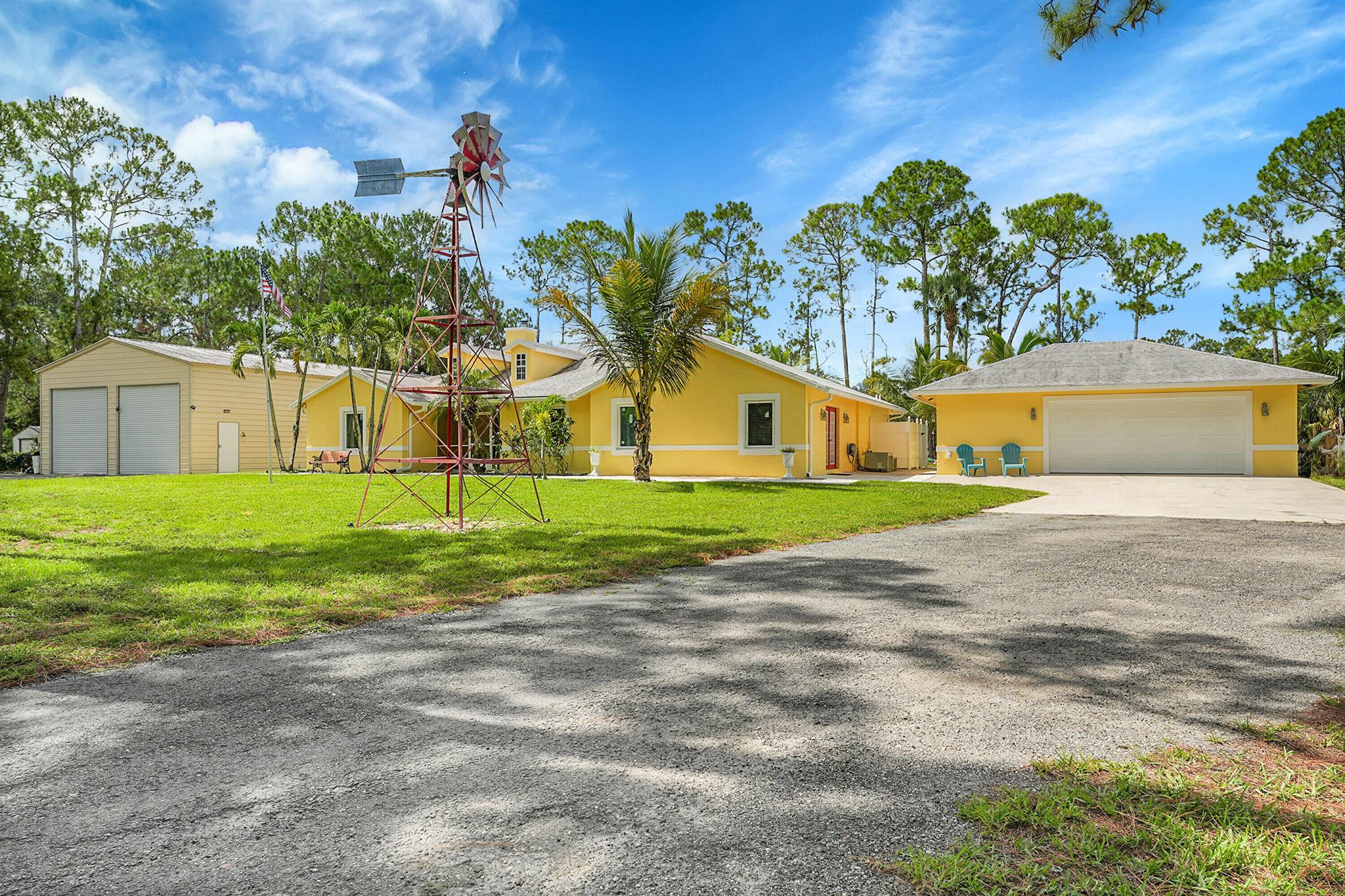Welcome to this beautiful NON HOA 4 bedroom, 2 bathroom home that includes a bonus room/office & 2 detached buildings.Nestled on 1.3 Acres this home has it all. Brand new hurricane impact windows, A split bedroom floor plan showcasing a primary bedroom retreat to enjoy your own peaceful space with a walk-in closet bigger than you can picture!The kitchen is completely redone with brand-new stainless steel appliances, cabinets and new floors throughout the house.Outside you'll find a screened in covered porch perfect for entertaining, a sparkling in ground pool, 2 storage sheds and plenty of room for the animals. The massive detached shop is 30 x 65, has electric, a car lift with double roll up door in front & one in the back. There is RV hook up.