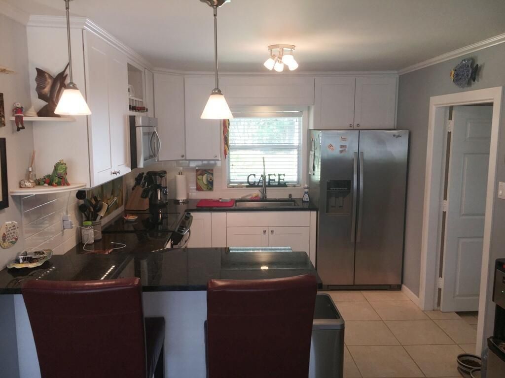 Photo of 5006 SE Capstan Avenue Ave, Stuart, FL 34997 (MLS # R10708669)