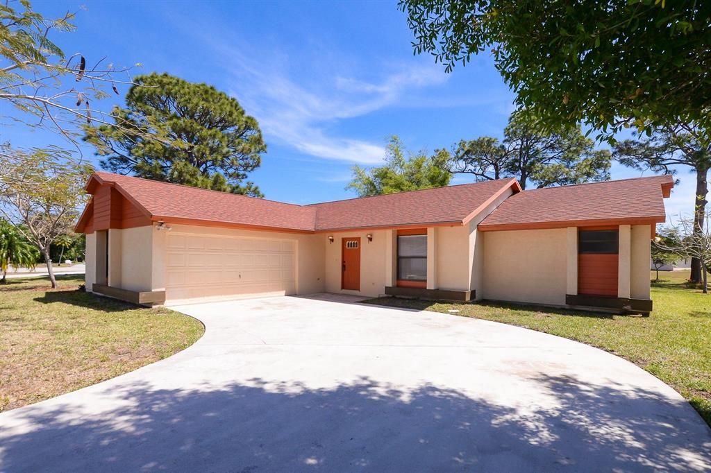 Photo of 2141 SE Triumph Road, Port Saint Lucie, FL 34952 (MLS # R10706499)