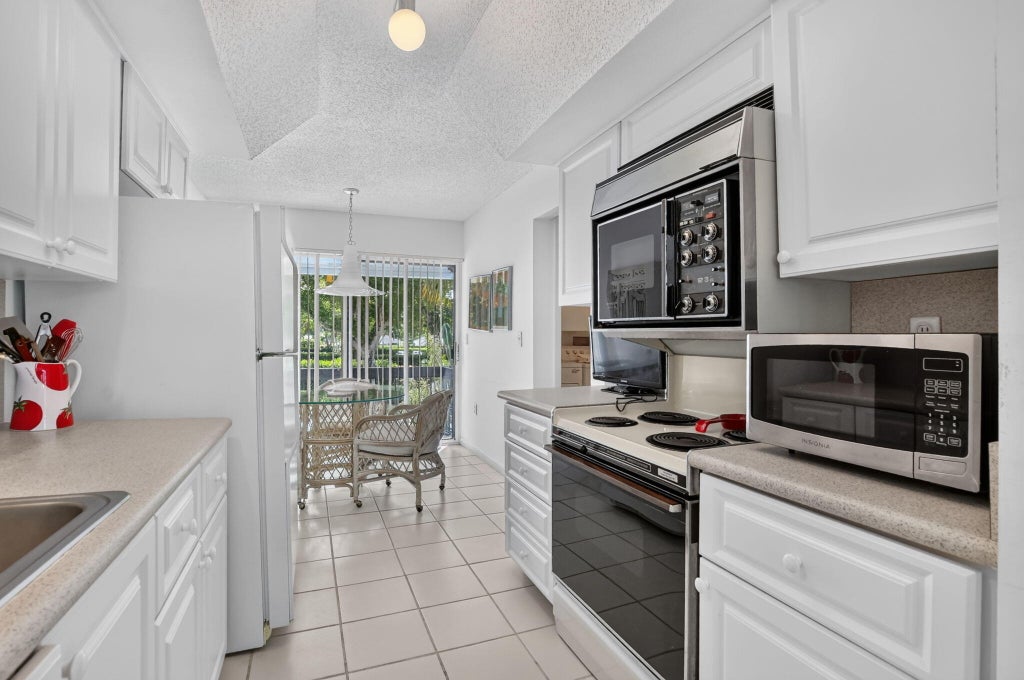 Photo of 6800 Willow Wood Drive #906, Boca Raton, FL 33434 (MLS # B26089747)