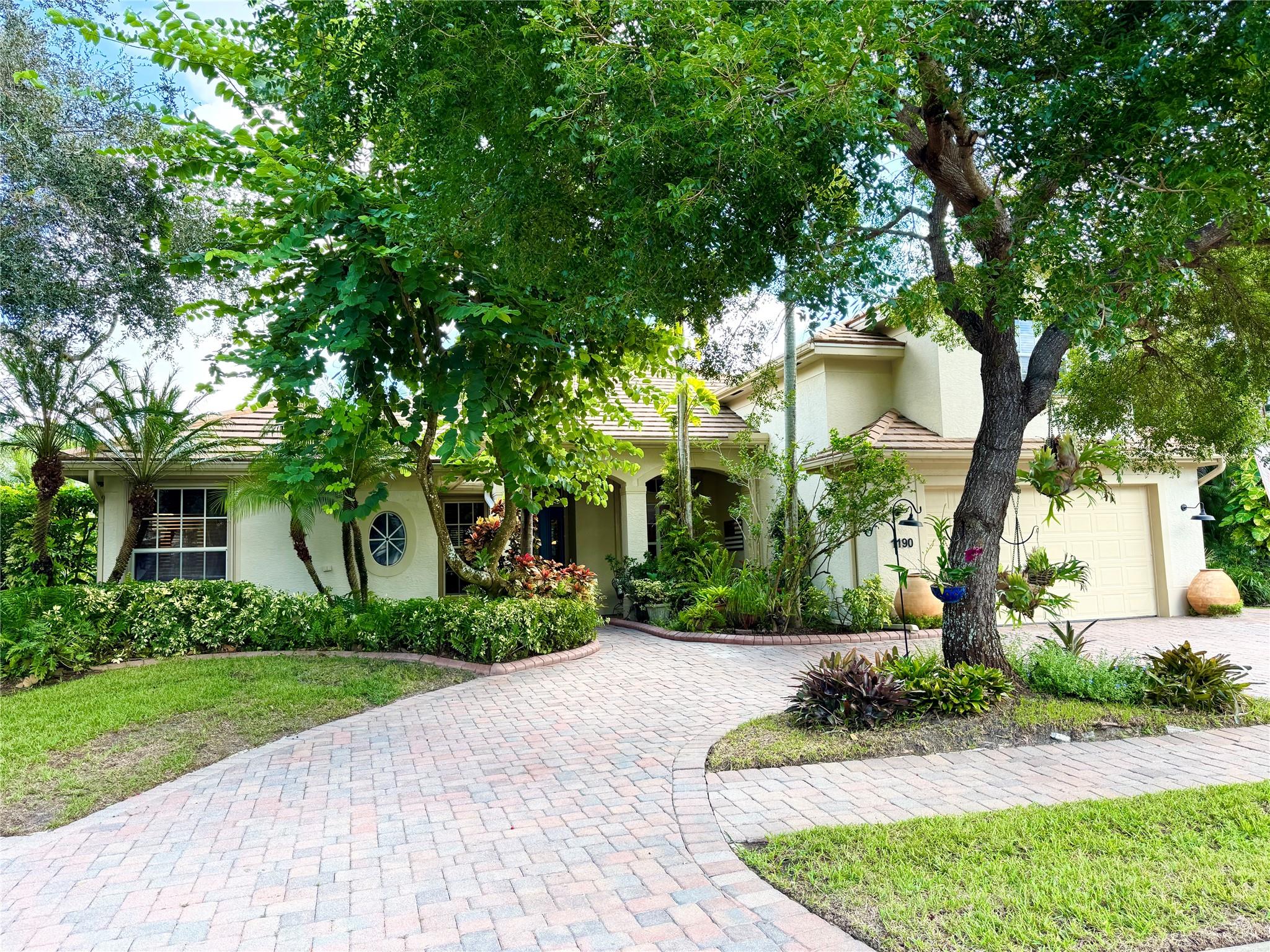 3,100 sq. ft. home features 4BED+Office, 3BA and a second story bonus room! Add to that a separate living room, family room and dining room and you have a house your whole family can enjoy. A large private screened lanai and 2024 resurfacing of the sparkling in-ground pool w/spa and waterfall overlooks a tranquil pond, creating an ideal setting for relaxation and entertaining. The paver circular driveway and 2-car garage offers plenty of parking space. Additional upgrades include whole house re-piping, porcelain wood-look tile flooring, two newer AC units, and accordion hurricane shutters.