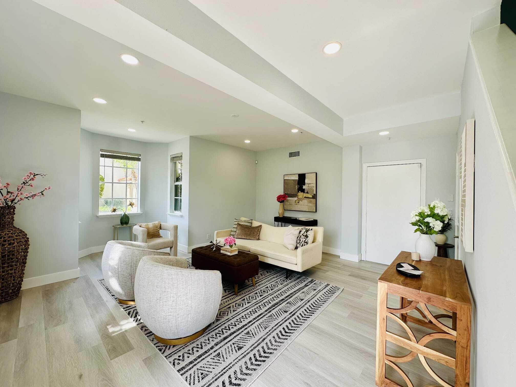 Live the ultimate coastal lifestyle in this beautifully updated 3BR/3.1BA townhome located in the community of Old Palm Grove. Just minutes from the beach and Atlantic Avenue, this 3-story residence offers 2,000 sq ft of elegant living space with soaring ceilings, new luxury flooring, fresh paint, and impact glass throughout. The versatile layout includes a first-floor living/flex room, a light-filled main living area with an open concept kitchen, granite countertops, stainless steel appliances, and two en-suite bedrooms upstairs, including a spacious primary suite with spa-like bath and LED mirrors. Enjoy a 2-car garage with epoxy flooring and updated lighting. Community amenities include a pool, tropical landscaping, and scenic walkability to top local attractions!
