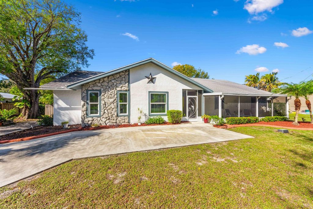 Photo of 4919 NW Pinetree Drive, Fort Pierce, FL 34982 (MLS # R10952350)