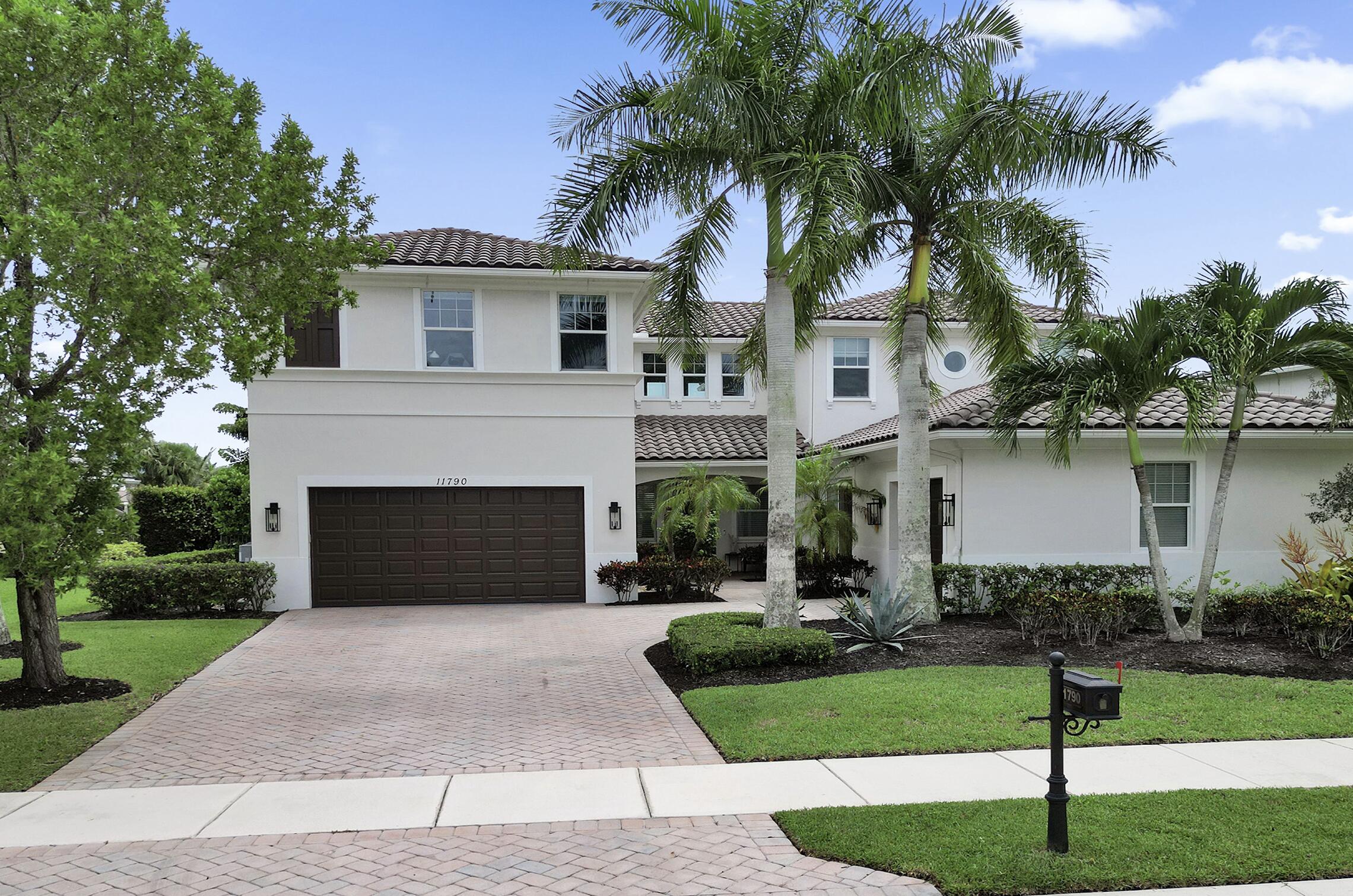 Step into elegance with this 5BR, 4.5BA former model home in the sought-after gated community of Heron Bay, offering 4,124 sq ft of bright, open living. A soaring 22-ft ceiling, wood floors, and lake views from most spaces set the tone. Entertain in the chef's kitchen with a natural gas stove, stainless appliances, and butler's pantry, or enjoy movie nights in the family room with built-in speakers. Outside, relax in the remodeled backyard with a heated saltwater pool/spa. The master retreat features lake views, double shower, and soaking tub. Enjoy peace of mind with impact windows/doors, smart home systems, 2 recently replaced ACs, fresh exterior paint and new garage door openers. With A+ schools and resort-style amenities, this home is move-in ready and ideal for family living.