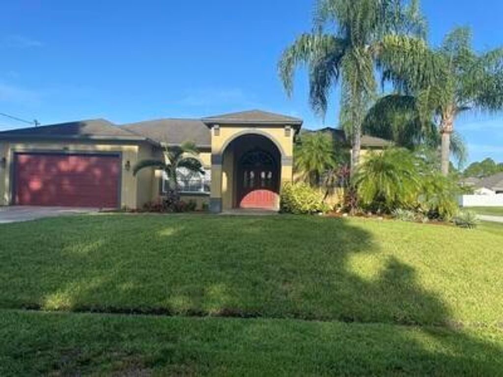 Photo of 3702 SW Masilunas Street, Port St Lucie, FL 34953 (MLS # R10913335)
