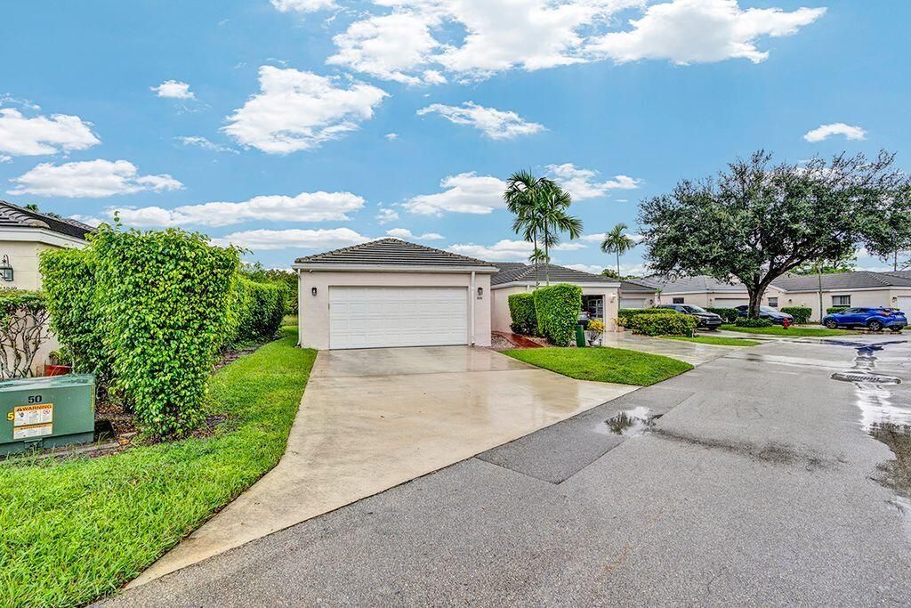 Photo of 1048 Island Manor Drive, Greenacres, FL 33413 (MLS # R11126164)