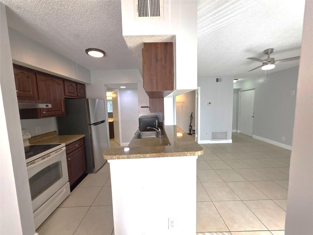 Photo of 5672 Rock Island Road #251, Tamarac, FL 33319 (MLS # F10541983)