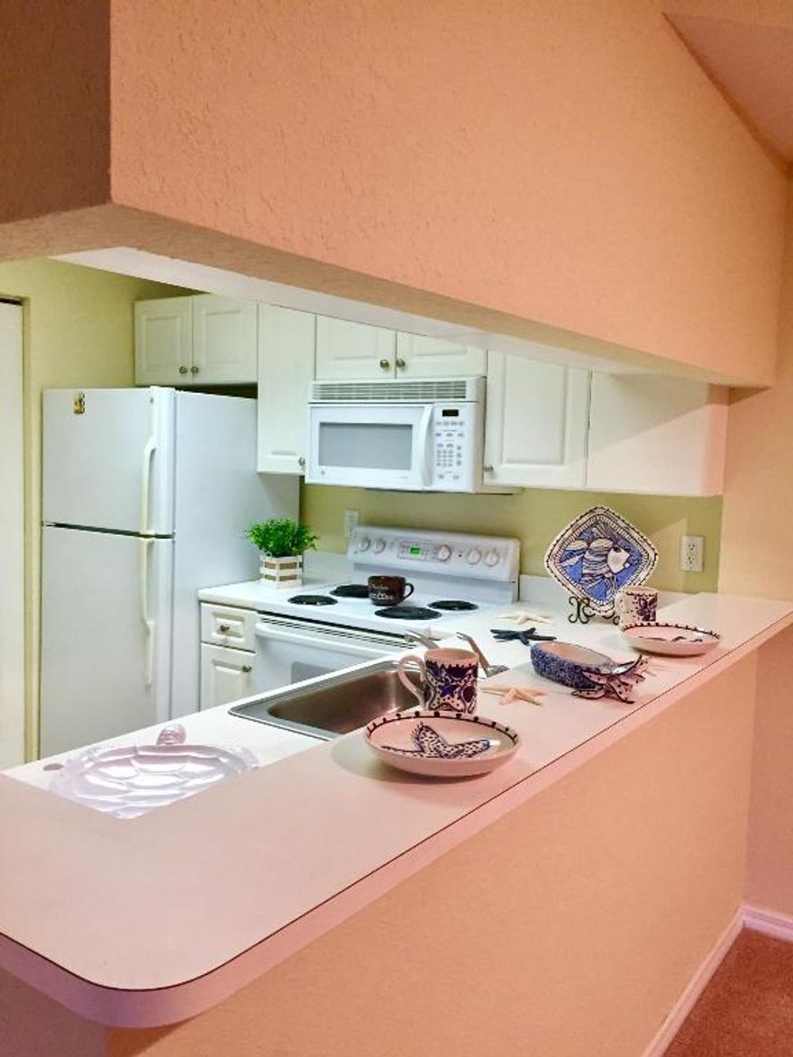 CLEAN AS A WHISTLE! BRAND NEW CARPET THROUGH OUT!  TWO MASTER SUITES, MASTER SUITE OFFERS LARGE WALK IN CLOSET, ENSUITE BATHROOM,SOAKING TUB,WHITE WOOD CABINETRY AND LINEN CLOSET. SECOND MASTER SUITE HAS OWN ENTRANCE TO BATHROOM WITH WHITE WOOD CABINETRY AND PLENTY OF CLOSET SPACE W/ ADDITIONAL LINEN CLOSET. LARGE LIVING AREA WITH SLIDING GLASS DOORS LEADING TO COVERED AND FULLY SCREENED BALCONY AREA SURROUNDED BY PALM TREES FOR PRIVACY. LARGE DINING AREA WITH BREAKFAST BAR. SEPERATE UTILITY ROOM W/ FULL SIZED WASHER DRYER AND ADDITIONAL SHELVING FOR STORAGE. KITCHEN FEATURES ALL WHITE WOOD CABINETRY.THIS UNIT IS LOCATED NEXT TO THE CLUBHOUSE AREA. GATED COMMUNITY WITH PATROLLED SECURITY AND ALARM SYSTEM IN UNIT. More... ADDITIONAL BONUS STORAGE CLOSE. THIS UNIT IS LOCATED NEXT TO THE CLUBHOUSE AREA. GATED COMMUNITY WITH PATROLLED SECURITY AND ALARM SYSTEM IN UNIT. ADDITIONAL BONUS STORAGE CLOSET!
OWNER HAS PREPAID HOA MANDATORY SECURITY DEPOSIT FOR YOU! CLUBHOUSE FEATURES GYM W/TREADMILLS,ellipticals,FREE AND MACHINE WEIGHTS,saunas,CHILDREN'S PLAYROOM,EXECUTIVE CENTER, EXQUISITE POOL AND SPA AREA TENNIS COURTS AS WELL! MANAGEMENT ON SITE! LOCATATED BEHIND GARDENS MALL, CLOSE TO DOWNTOWN GARDENS, PALM BEACH STATE COLLEGE, INTRA COASTAL WATERWAY, 95 AND THE TURNPIKE FOR EASY COMMUTING. CLOSE TO GREAT RESTAURANTS, MOVIE THEATRES, POST OFFICE AND GOLF COURSES. MUST SEE TO APPRECIATE!