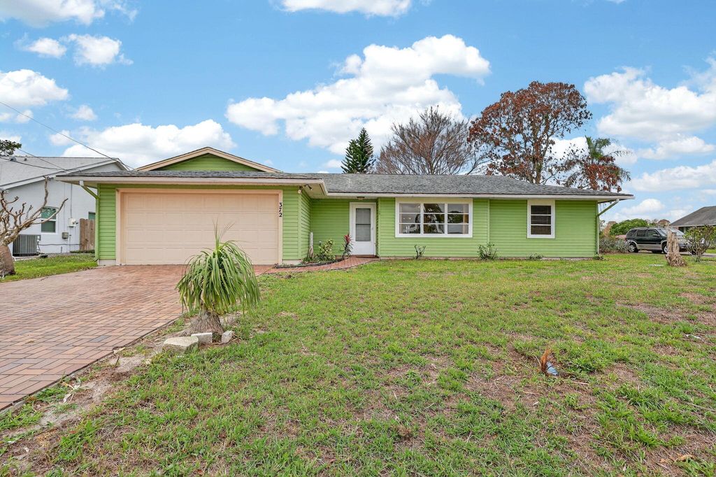 Photo of 372 SW Carter Avenue, Port Saint Lucie, FL 34983 (MLS # B26011235)