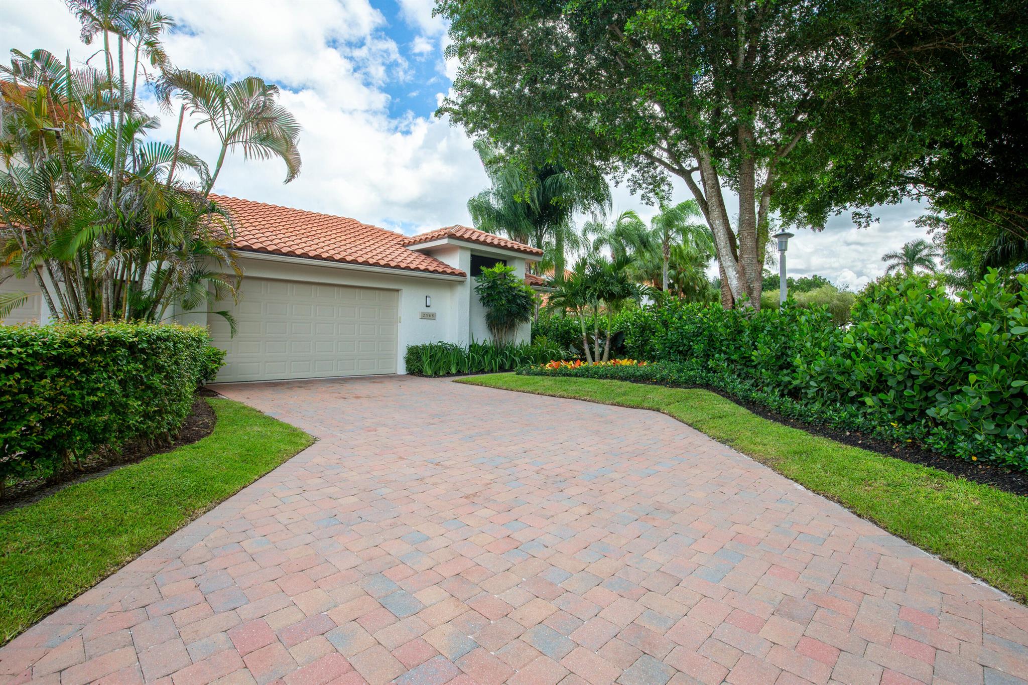 This 3 bedroom/3 bath/2 car garage and gorgeous pool home features a sophisticated, remodeled interior with vaulted ceilings, wood floors in the main living areas and will soon be outfitted with windows and impact doors and freshly painted. The sleek and modern kitchen is very spacious, fitted with a large center island with bar seating and new high end, stainless steel appliances. Next to the kitchen is a separate bar with bar seating, perfect for entertaining. High ceilings and floor-to-ceiling windows give a welcoming, bright and spacious feel.