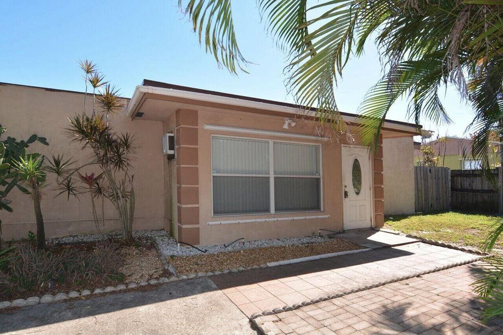 Photo of 472 Seminole Drive, Atlantis, FL 33462 (MLS # R10979043)