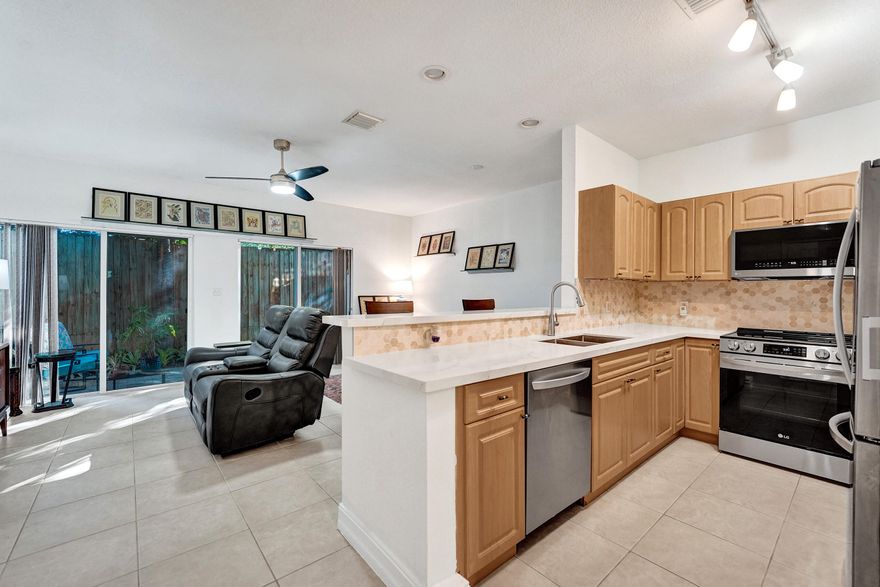 Located in the highly sought-after River Landings community, this stunning 2-bedroom, 2.5-bathroom townhome is just a few blocks from the vibrant Wilton Drive and only minutes from Fort Lauderdale Beach and downtown. Featuring beautiful finishes and stainless steel appliances, the home offers a perfect blend of style and comfort. Upstairs, two spacious bedrooms each have ensuite bathrooms, walk-in closets, and elegant wood flooring in the hallway. Vaulted ceilings create an airy, expansive feel. A one-car garage and driveway provide convenient parking, while the community offers a pool and picnic area for residents to enjoy. This is a rare opportunity to live in one of Fort Lauderdale's hidden gems! Roof 2024