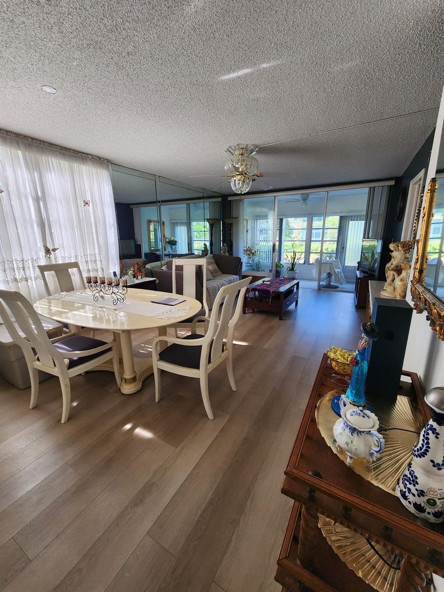 Beautiful 2-bedroom, 2-bath corner unit being sold as-is! Bright and spacious with a well-designed layout, large closets, laminate and carpet flooring, and ceiling fans throughout. Located on the first floor, enjoy tranquil, water views from the enclosed balcony. In great condition and move-in ready! Resort-style amenities include clubhouse, pools, fitness center, theatre, billiards, tennis, and library. HOA covers pest control, water, sewer, trash, and cable at a low monthly fee. Extra storage and assigned parking included. Seller is motivated!