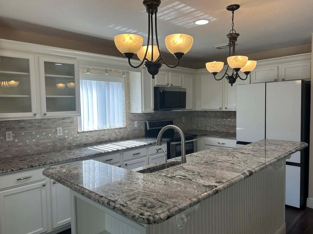 Photo of 1019 Big Torch Street, Riviera Beach, FL 33407 (MLS # B26038795)