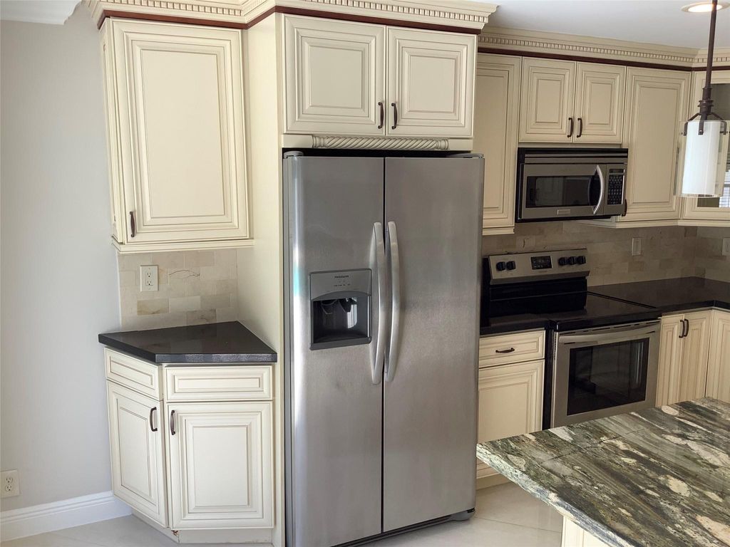 Photo of 4381 NW 1st Drive, Deerfield Beach, FL 33442 (MLS # F10524602)