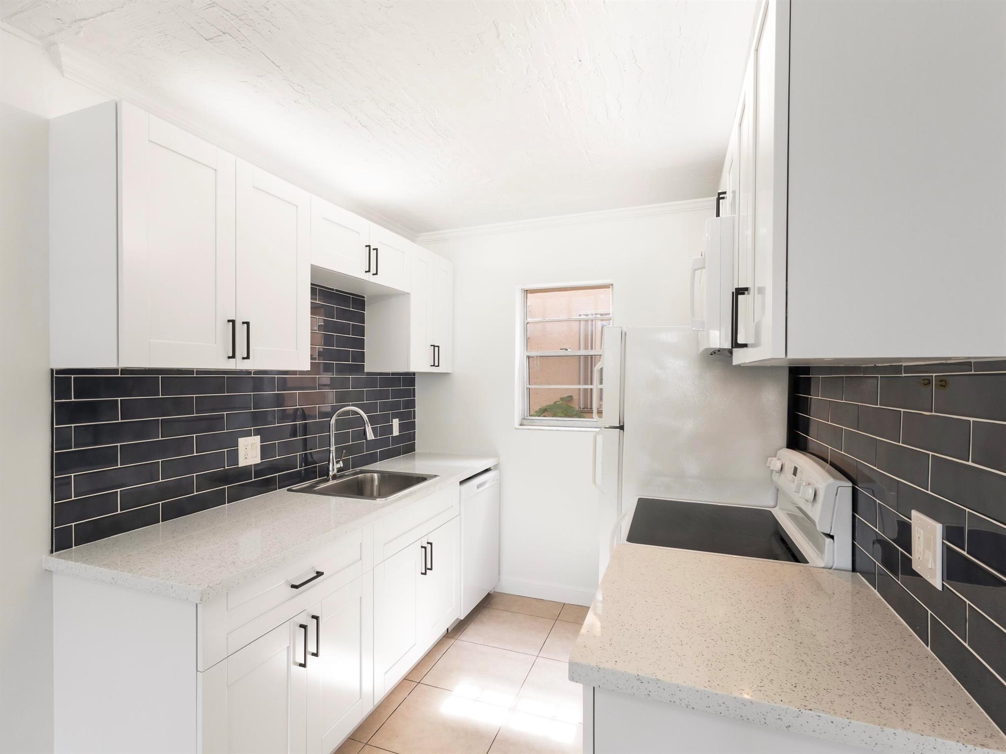FIRST FLOOR 2/2 NEWLY UPDATED CONDO! FRESHLY PAINTED BRIGHT AND LIGHT. INVESTORS WELCOME! PRIME EAST BOCA RATON LOCATION, WALKING DISTANCE TO SHOPS, STORES, SCHOOLS, MIZNER PARK, BRIGHT LINE, ETC. MOVE IN READY. GREAT INCOME OPPORTUNITY. ASSIGNED PARKING. COMMUNITY W&D IN FRONT OF THE UNIT.